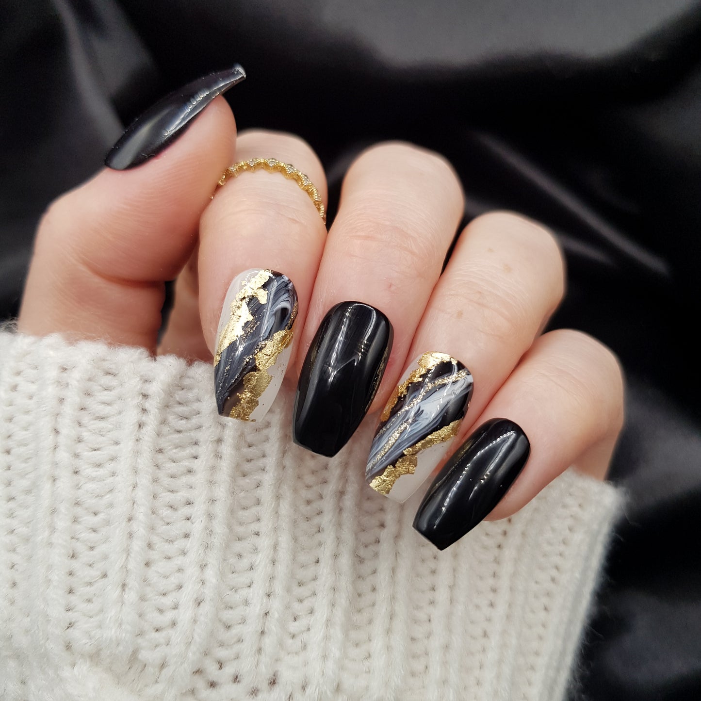 Signature: Black swirl